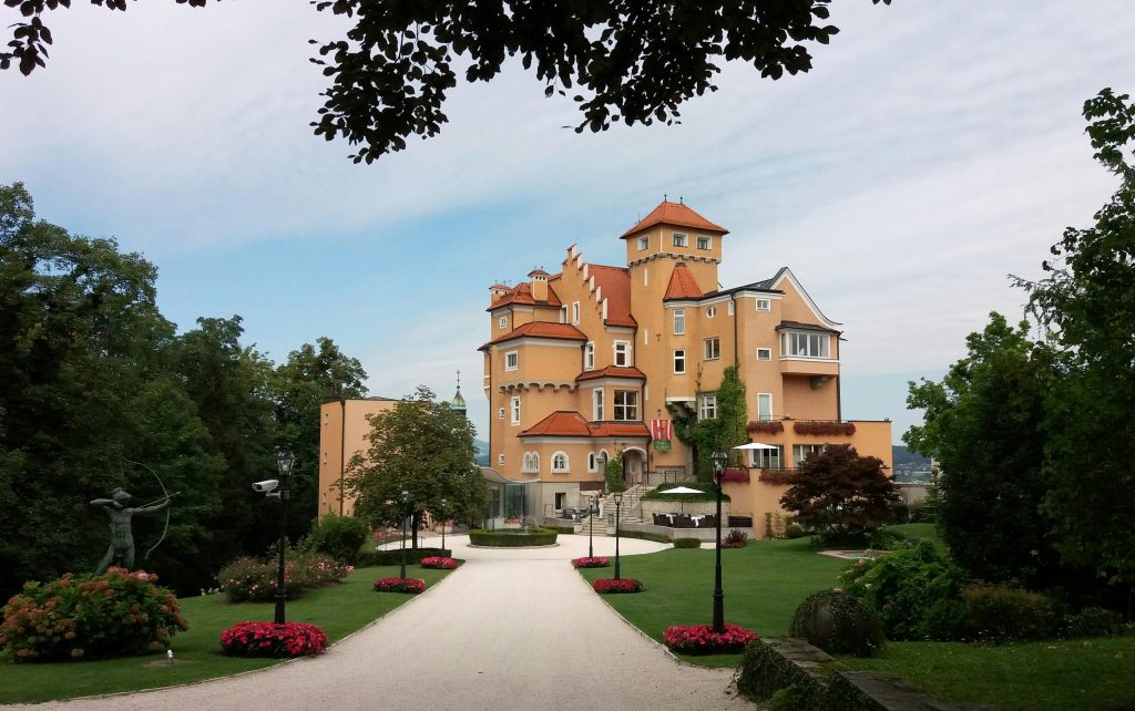 A bulding among one of the luxury 4 star hotels in Salzburg with multiple windows