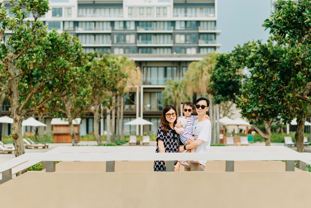 An image of a family infront of a building depicting a family friendly hotels in Salzburg
