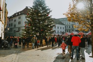 An image of a busy road with people infront one of the Best Family Hotels in Austria